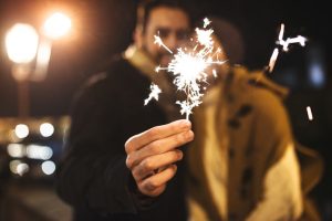 couple with sparkler for the new year