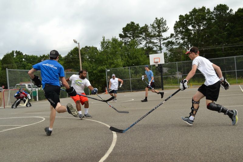 Imran Playing Street Hockey