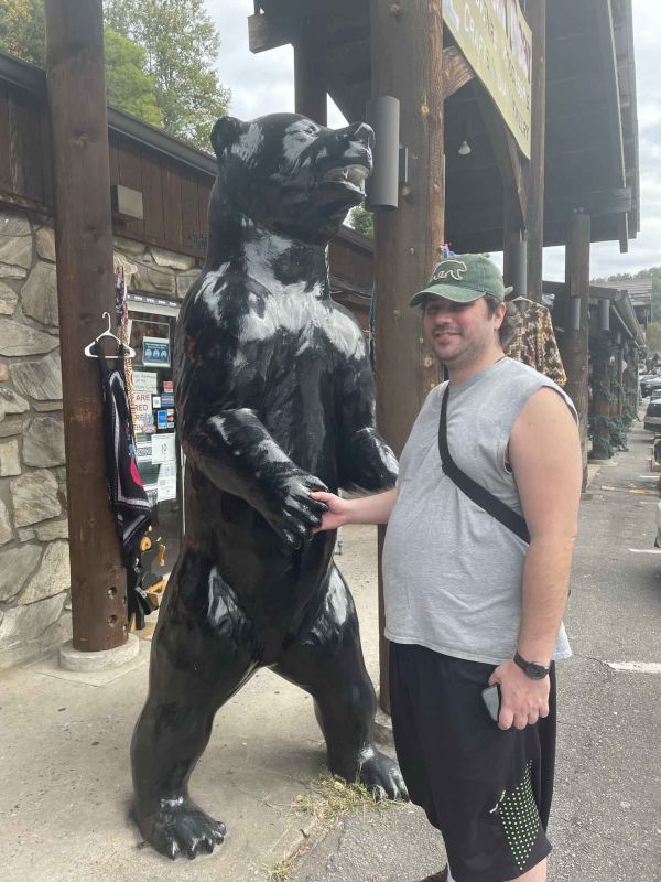 Kris Shaking Hands with a Bear Statue