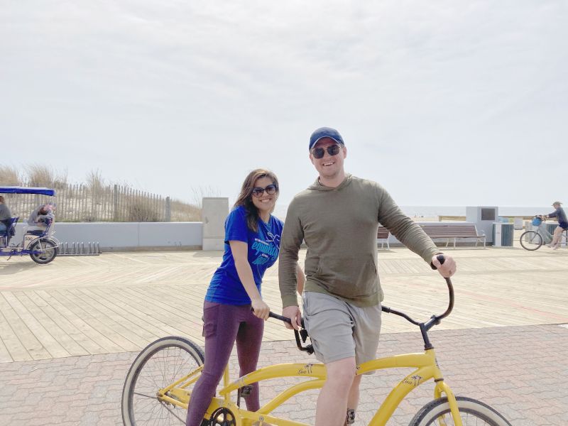 Riding a Tandem Bike on a Beach Boardwalk